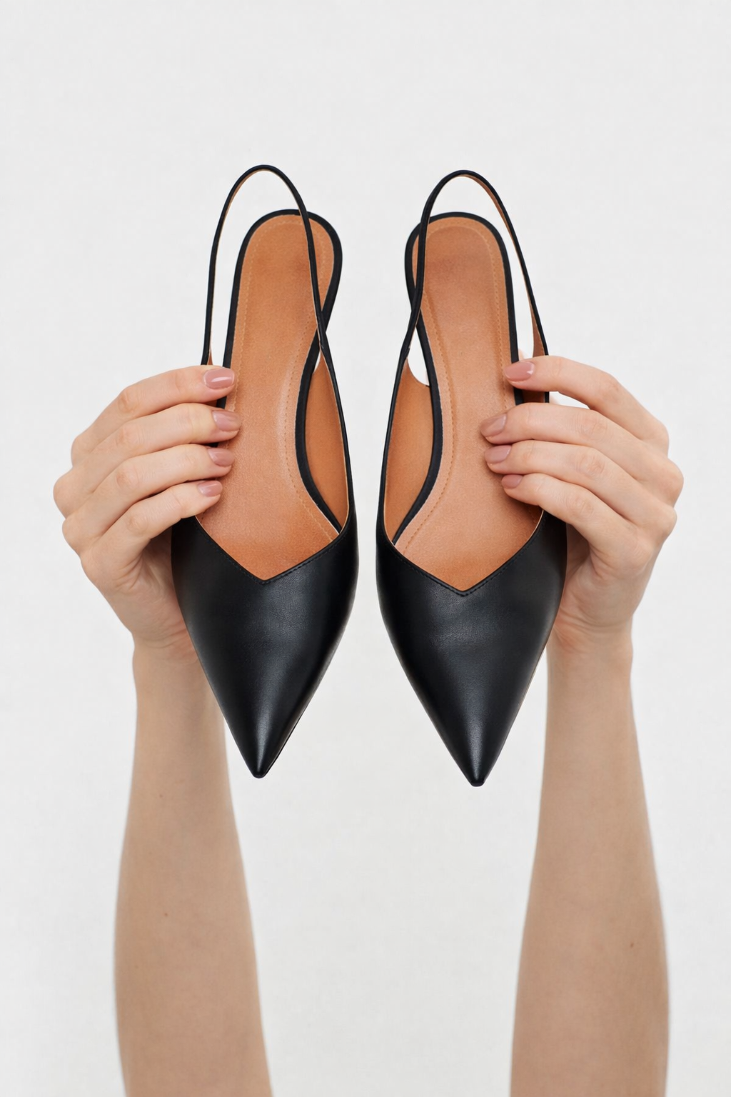 Black pointed-toe slingback shoes